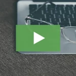 clickable video thumbnail showing reading glasses placed on top of laptop