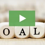 clickable video thumbnail showing wooden blocks that spell out the word "goals"