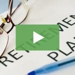 clickable video thumbnail depicting a pair of glasses on a "retirement plan" document