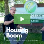 clickable video thumbnail showing the resource center's founder talking about housing bubble