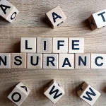 Wooden blocks with alphabet letters on them that spell "Life Insurance"